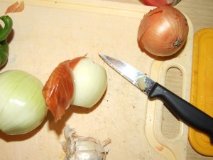 First, onion is peeled. Throw out the peelings.